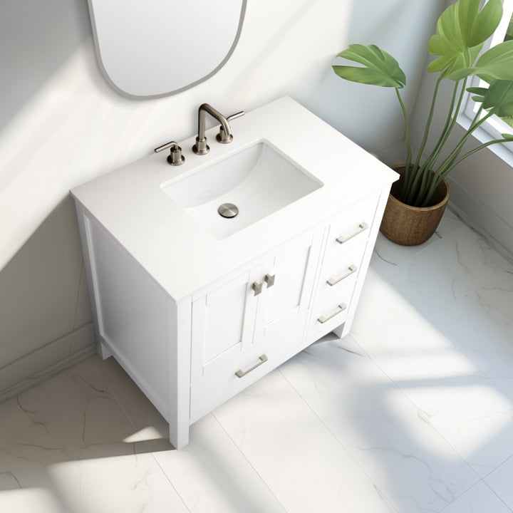 The Vanea 36 inch Bathroom Vanity in White with White Quartz Top includes a rectangular sink, silver faucet, and drawer handles. Sunlight brightens the white tile floor, while a green potted plant brings a touch of freshness to the space.