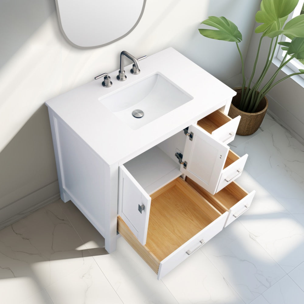 The Vanea 36 inch Bathroom Vanity in White with White Quartz Top features an open sink cabinet and drawers showing light wood interiors, placed on a white tiled floor next to a green plant by a sunny window.