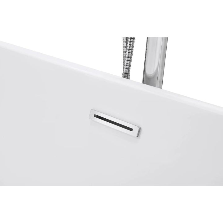 Close-up of the Luma Freestanding Bathtub edge, featuring a rectangular chrome overflow drain and part of a silver flexible shower hose in the background.