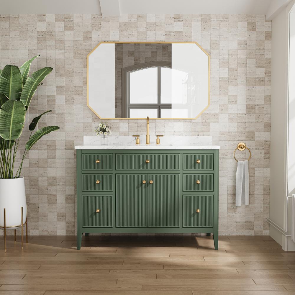 A modern bathroom with an Aveline 48 Inch Freestanding Bathroom Vanity with Top in green, gold fixtures, a white countertop, and an octagonal mirror. Light wood flooring and a potted plant on the left complete this stylish space.