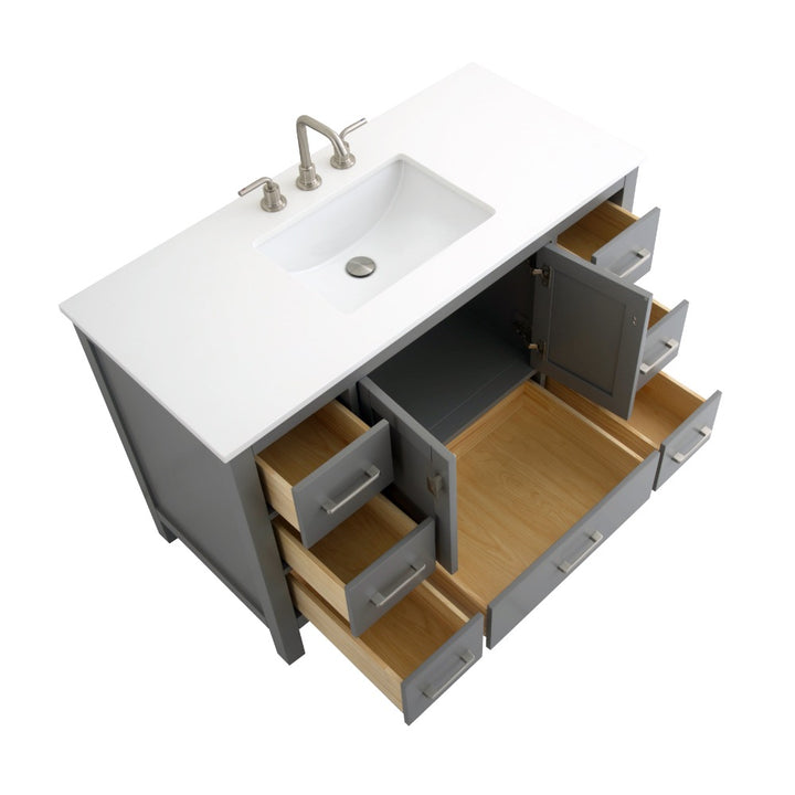 The Vanea 48 inch Bathroom Vanity in Gray features a white quartz top, built-in sink, and open drawers and cabinet doors that reveal light wood interiors.