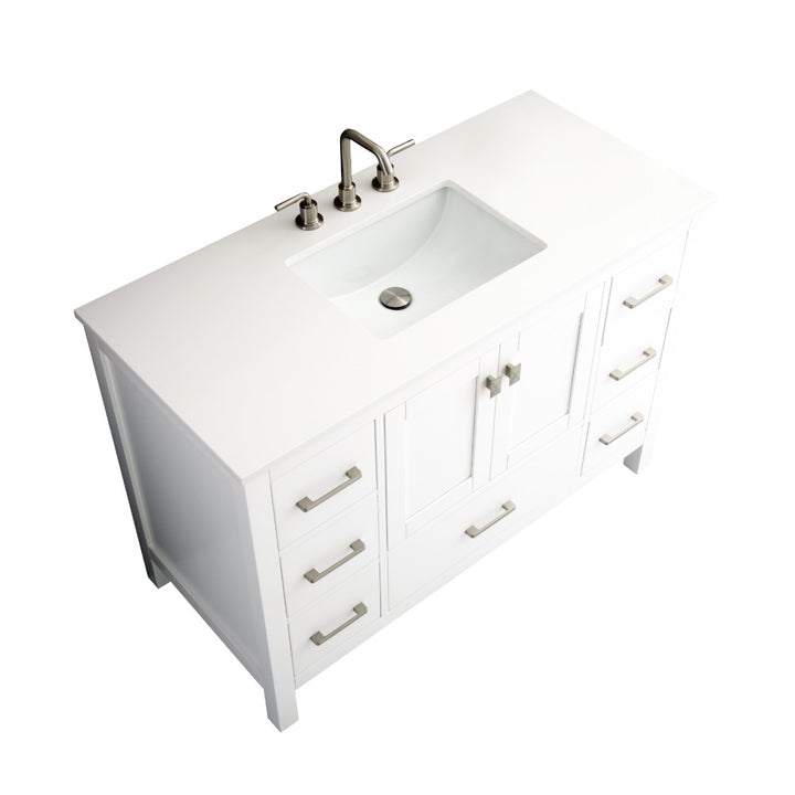The Vanea 48 inch Bathroom Vanity in White with White Quartz Top features a rectangular sink, silver faucet, and six side drawers with silver handles. Its smooth, seamless quartz countertop adds an elegant finishing touch.