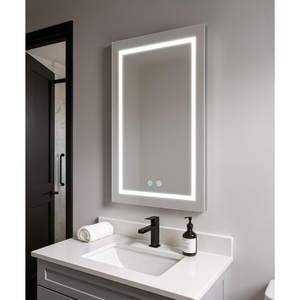 A modern bathroom vanity features the Daytona 24 Inch x 30 Inch LED Lighted Bathroom Mirror above a white sink with black faucet, rolled towel, and soap dispenser on a light gray countertop, with a black door and tiled shower in the background.