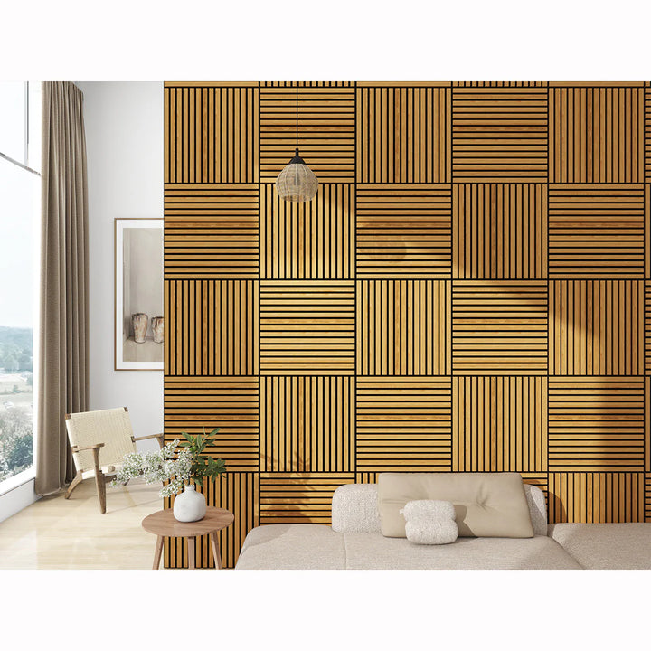 A modern living room features a statement wall with Acoustic Interior Wall Panels in alternating slat directions, a beige sofa with cushions, a round wooden table, a chair, and a tall window with curtains.