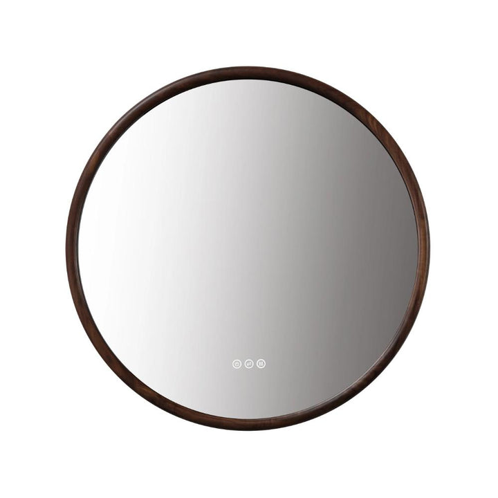 The Zen LED Mirror features a round design with a dark wooden frame and three subtle touch controls at the bottom center, highlighted against a plain white background for modern elegance.