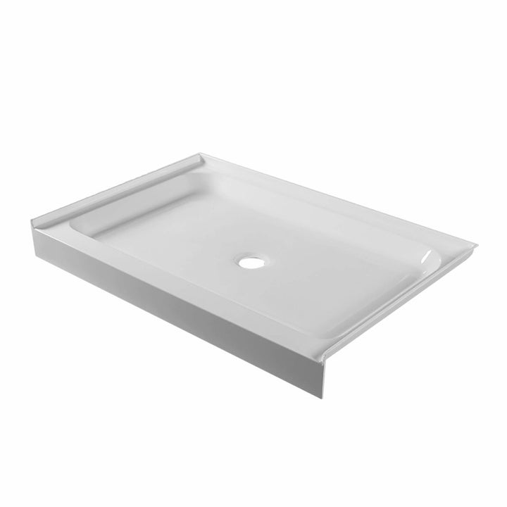 The Nova Shower Base is a rectangular, white base with three raised edges and a central drain. Its gently sloped surface ensures efficient water drainage.