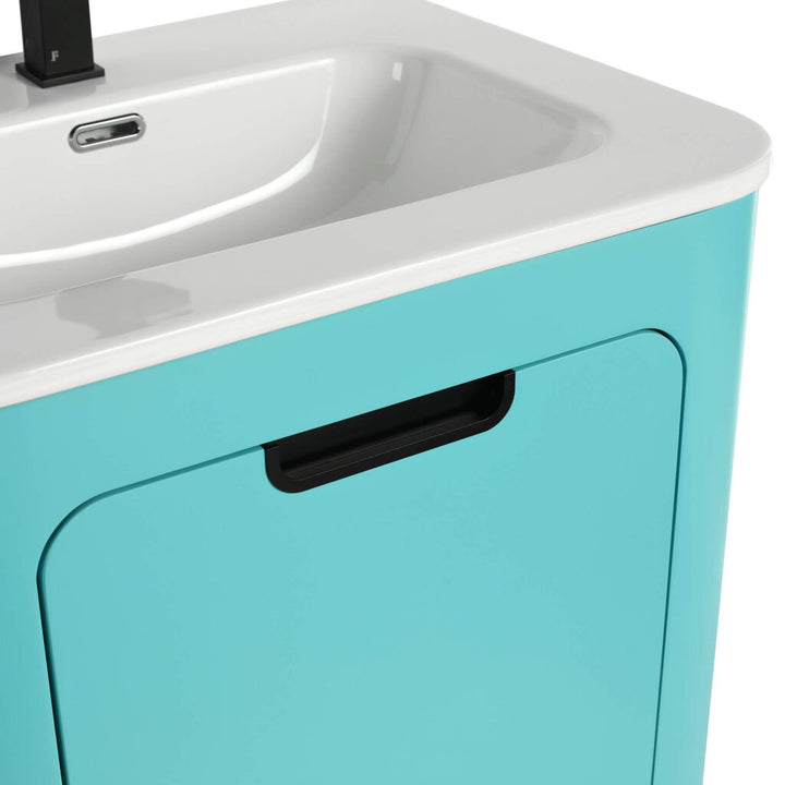 Close-up of the Shireplace 24 Inch Bathroom Vanity With Sink, featuring a turquoise cabinet, black recessed handle, and a rectangular white basin. The squared black faucet offers a striking contrast to the smooth curves of both the cabinet and basin.
