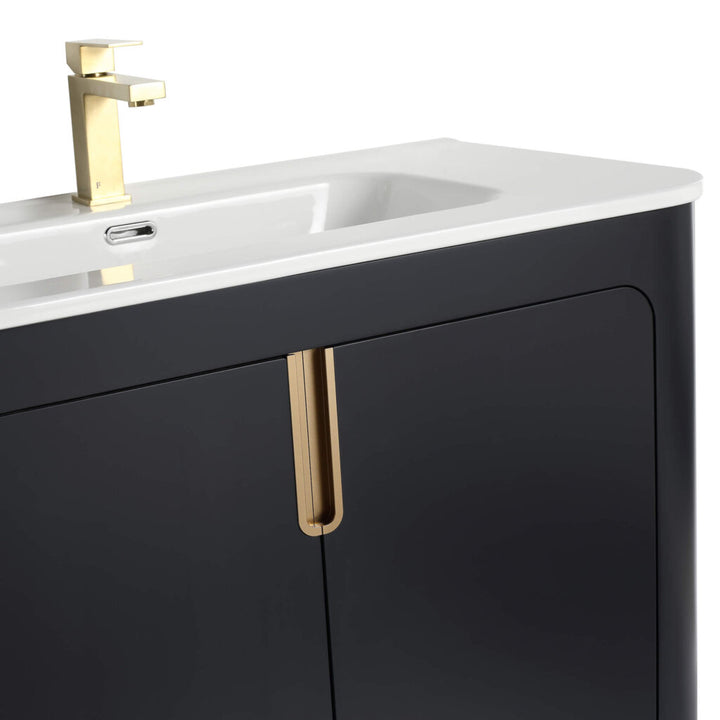 The Shireplace 36 Inch Bathroom Vanity With Sink highlights a modern white basin and gold faucet atop a sleek black vanity. Gold handles enhance its minimalist design, featuring clean lines and a glossy finish.