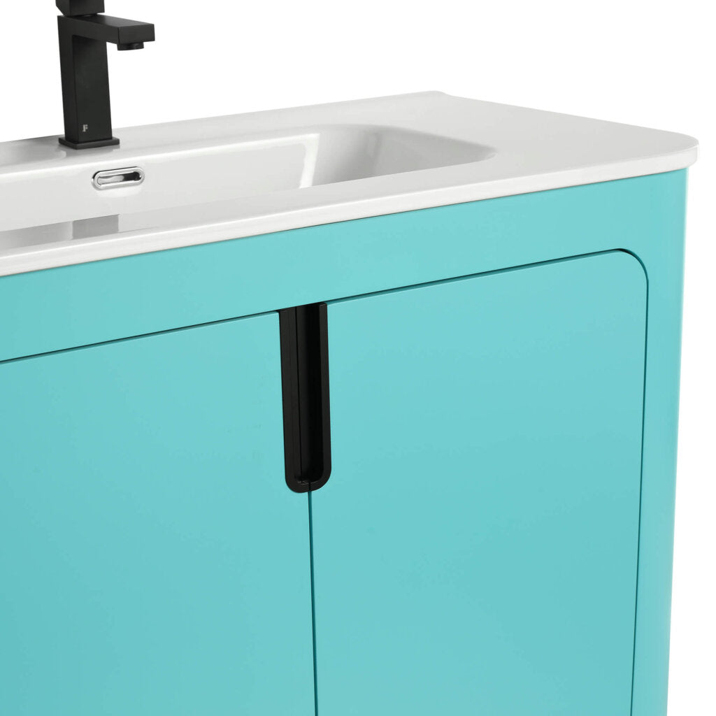 A close-up of the Shireplace 36 Inch Bathroom Vanity With Sink reveals its glossy teal finish and sleek black handle, featuring a minimalist design with a white basin and black faucet, perfect for adding elegance to any contemporary bathroom.