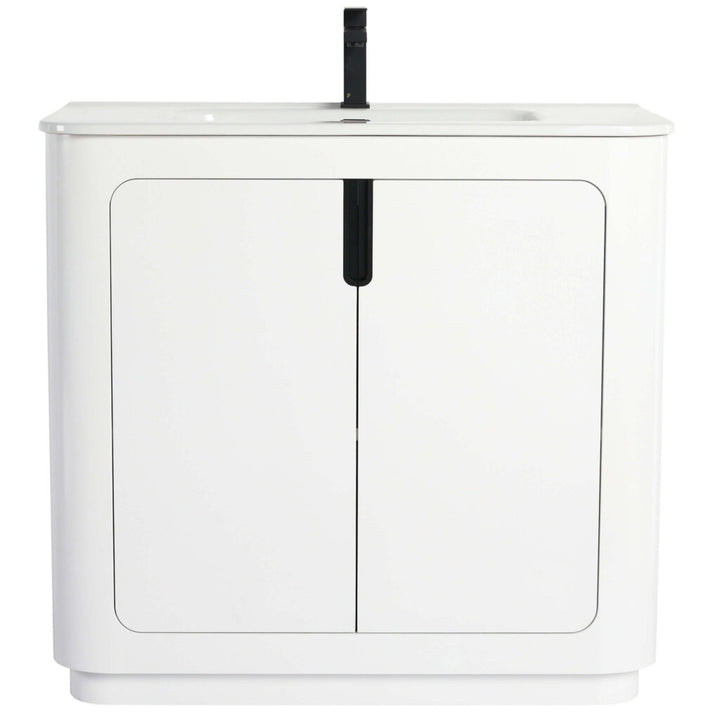The Shireplace 36 Inch Bathroom Vanity With Sink exudes modern elegance with its flat surface, integrated sink, and single black faucet. The cabinet features two doors with minimalist handles, offering a contemporary and streamlined design.