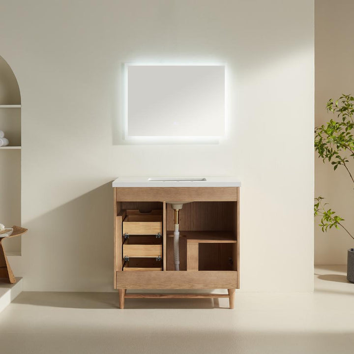 The Liora 30 Inch Bathroom Vanity features an open wooden cabinet with drawers and shelves, a sleek white countertop, and a backlit square mirror on a beige wall. A plant accents the right side of the modern space.