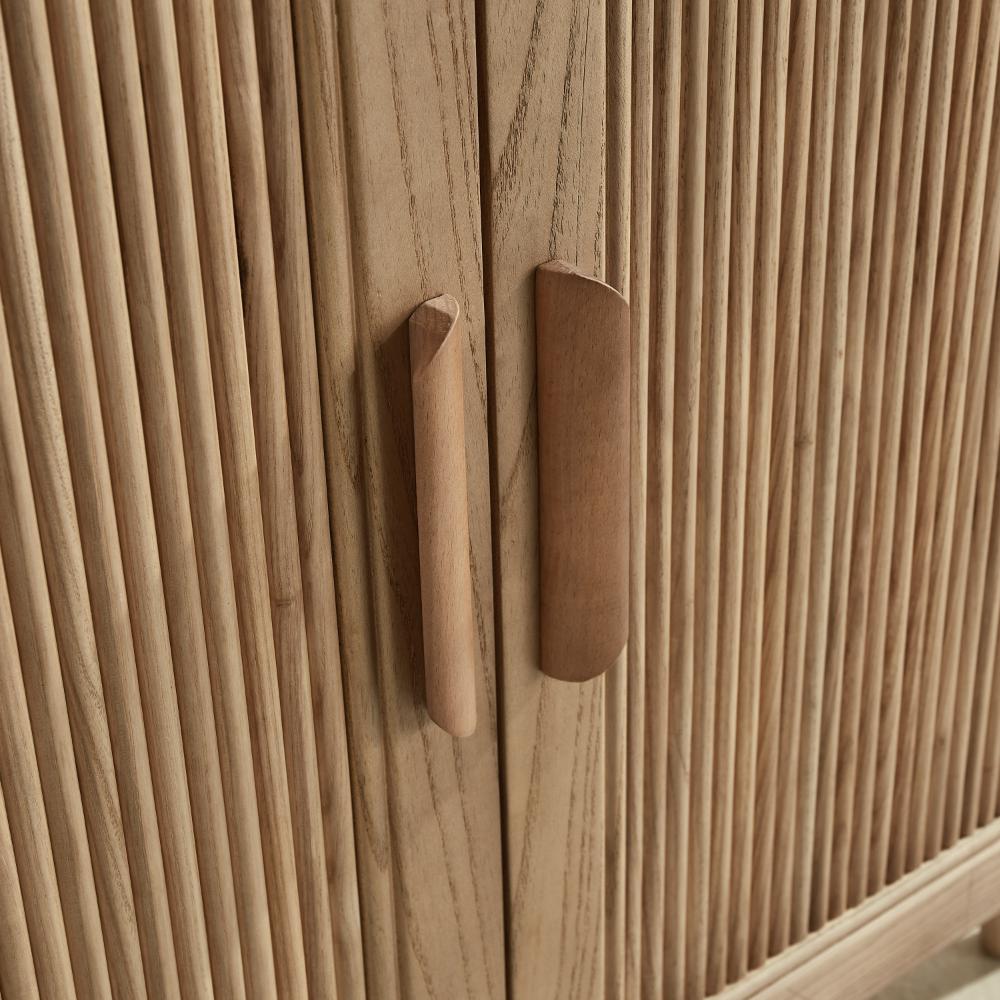 Close-up of the Liora 30 Inch Bathroom Vanity’s two wooden doors, featuring vertical grooves and modern angled handles in a natural light wood finish.