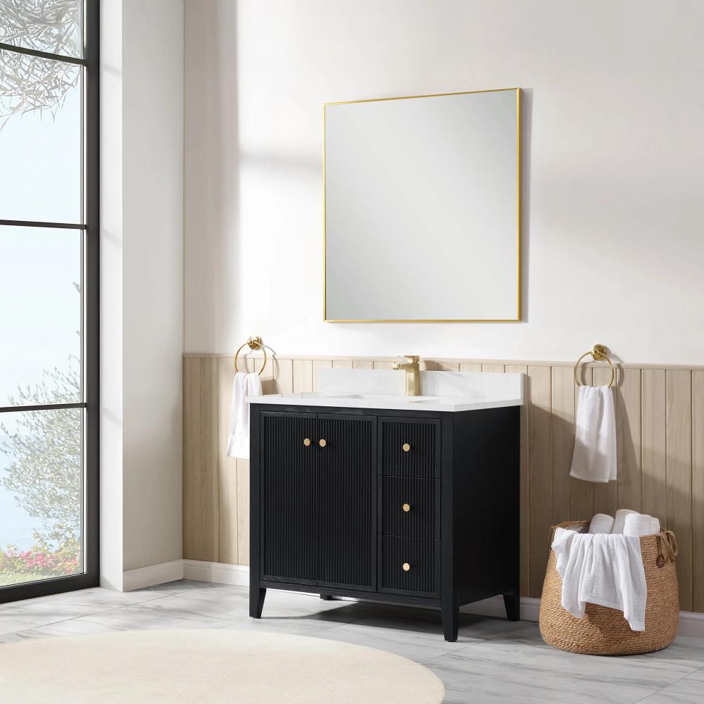 Modern bathroom featuring the Torino 36 Inch Bathroom Vanity Cabinet with drawers, gold faucet, square mirror with gold frame, towel rings with white towels, wicker basket of towels, and a large window letting in natural light.