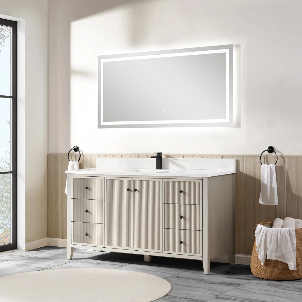 A bright, modern bathroom features the Torino 60 Inch Single Bathroom Vanity with a large lighted mirror above. The vanity includes black fixtures, multiple drawers, and white towels on black towel rings, with light wood and tile accents visible.