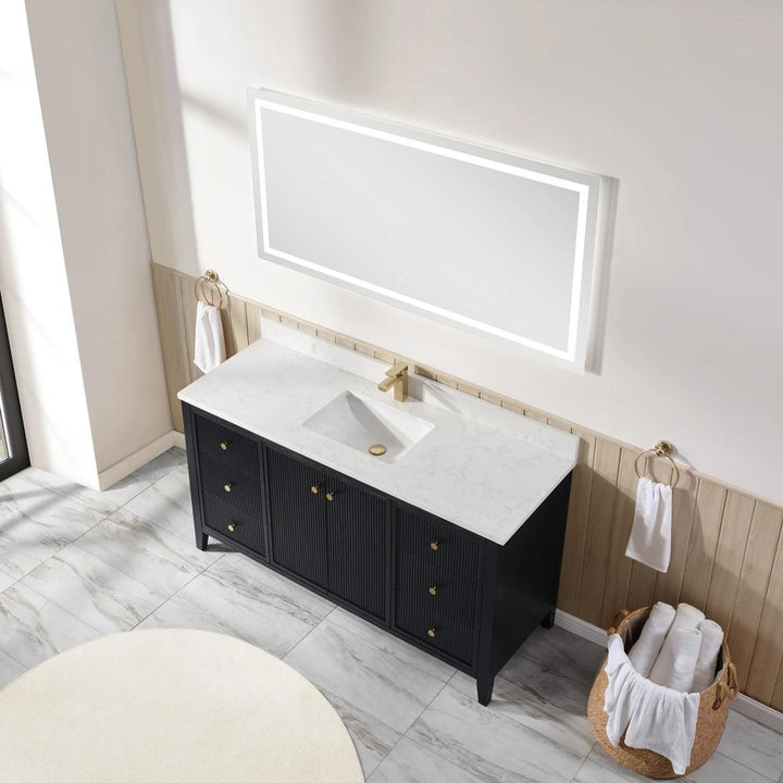 Modern bathroom featuring the Torino 60 Inch Single Bathroom Vanity with a large, backlit rectangular mirror above a white marble sink countertop. Towel rings with white towels flank the sink, and a basket of rolled towels sits on the floor.