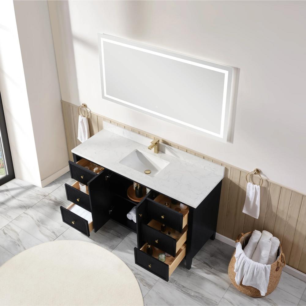 The Torino 60 Inch Single Bathroom Vanity features a white marble countertop, rectangular sink, gold faucet, black cabinets with open drawers, and is complemented by a large illuminated mirror above with towels and baskets nearby.
