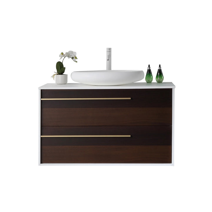 The Goreme 42 Inch Wall Mount Bathroom Vanity With Vessel Sink features dark wood drawers, gold handles, a white countertop with a round vessel sink, a white faucet, two green soap dispensers, and a small potted orchid plant.