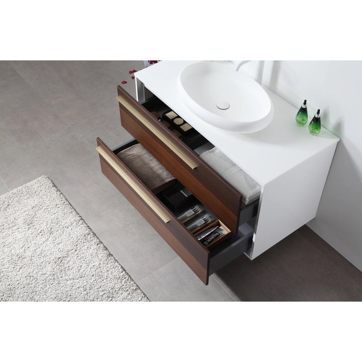 A modern Goreme 42 Inch Wall Mount Bathroom Vanity With Vessel Sink features two open wooden drawers for toiletries and towels, set on a gray tiled floor with a white rug and two green soap dispensers on the counter.