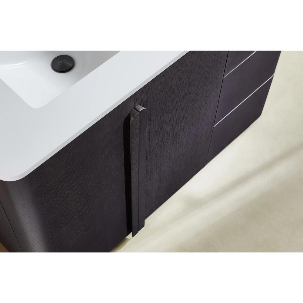 Close-up view of a Parma 48 Inch Bathroom Vanity With Top featuring dark wood cabinet doors, a rectangular white sink, and metal handle, set on a light-colored floor.