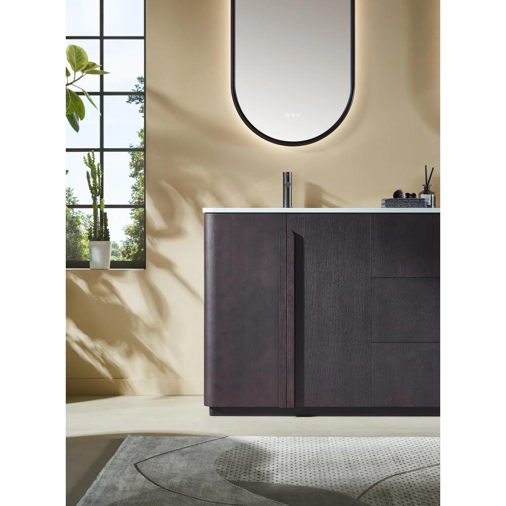 Modern bathroom with a Parma 72 Inch Double Bathroom Vanity With Top, white countertop, and tall oval mirror. A potted plant sits by a large window, patterned rug on the light floor, and soft natural light fills the space.
