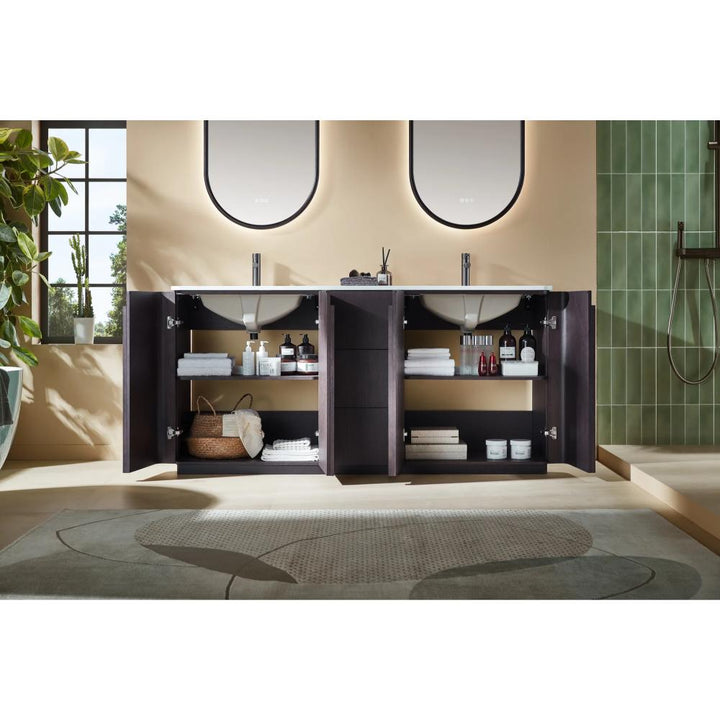 A modern bathroom featuring a Parma 72 Inch Double Bathroom Vanity With Top, dark wood cabinets with open doors showing towels and toiletries, two sinks with oval mirrors, plants, a walk-in shower on the right, light walls, and a patterned rug.