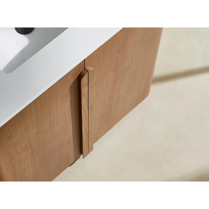 The Parma 36 Inch Bathroom Vanity With Top showcases a modern wood design, minimalist vertical handles, and a white sink, making it a stylish addition to any bathroom.
