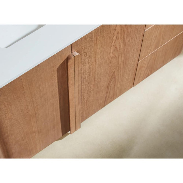 Close-up of the Parma 48 Inch Bathroom Vanity With Top featuring minimalist vertical handles and drawers, set against an off-white countertop and a light-colored floor.