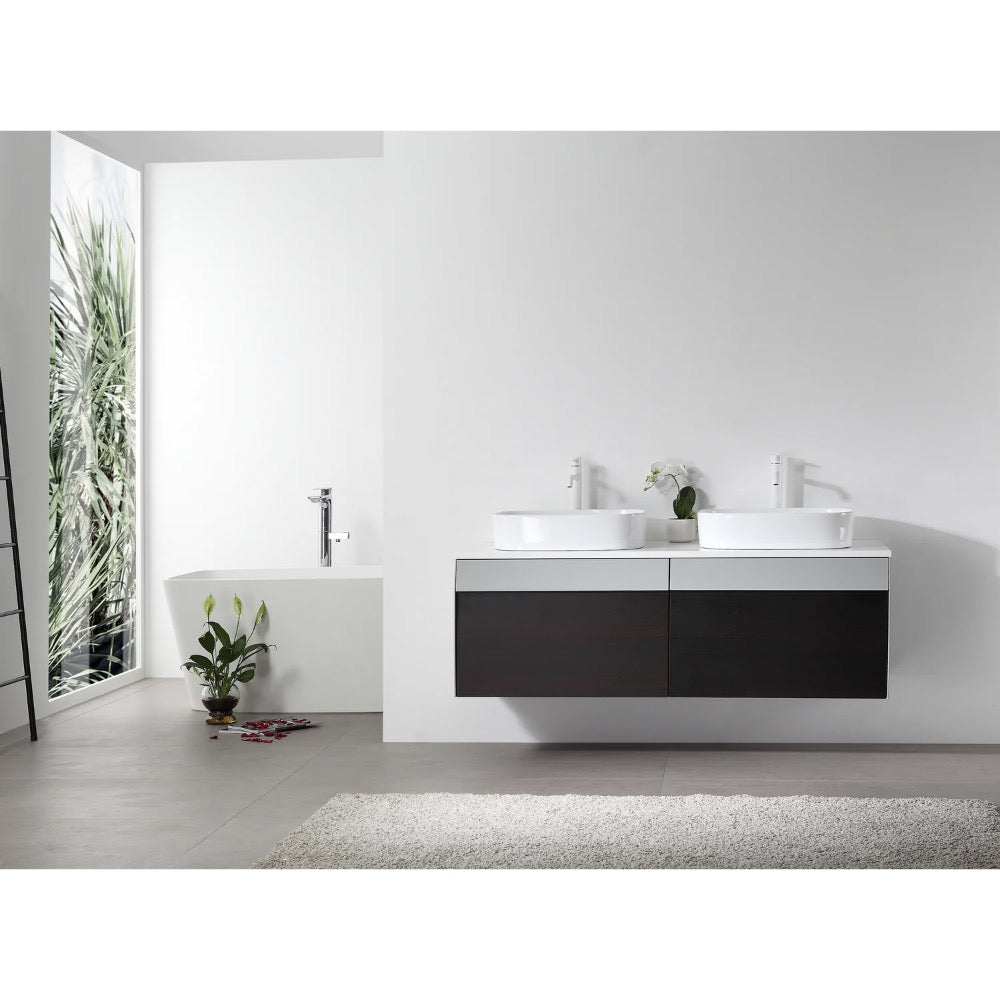 Modern minimalist bathroom featuring the Ronda 55 Inch Wall Mount Vanity with Double Vessel Sinks, a freestanding white tub by a large window, a small plant, and a gray rug on the white floor.
