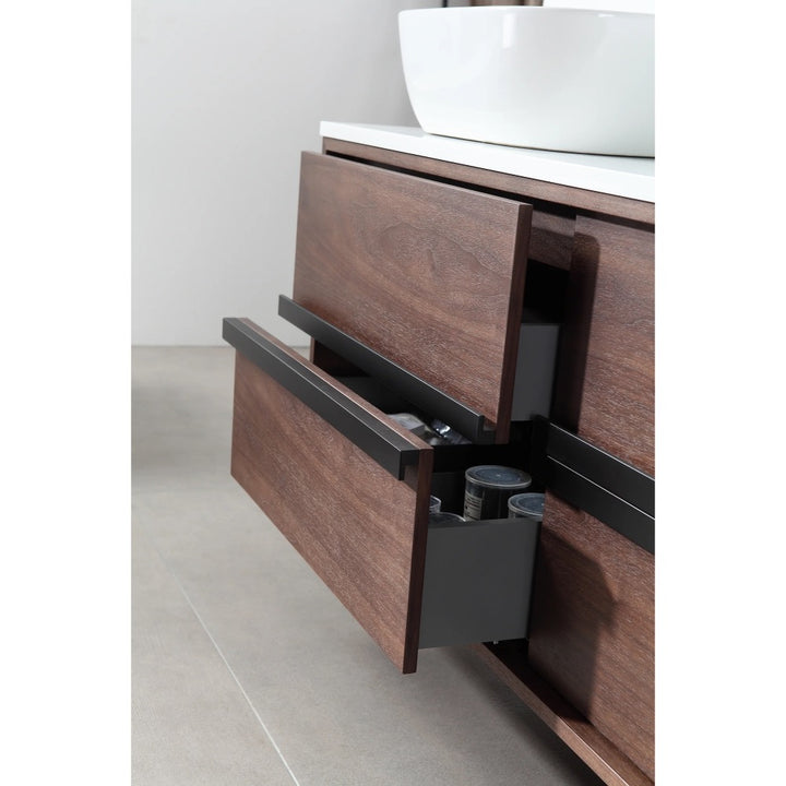 A close-up of two partially open drawers with black handles in the Sintra 55 Inch Wall Mount Vanity with Double Vessel Sinks reveals toiletries inside. The vanity is set against a light-toned tiled floor.