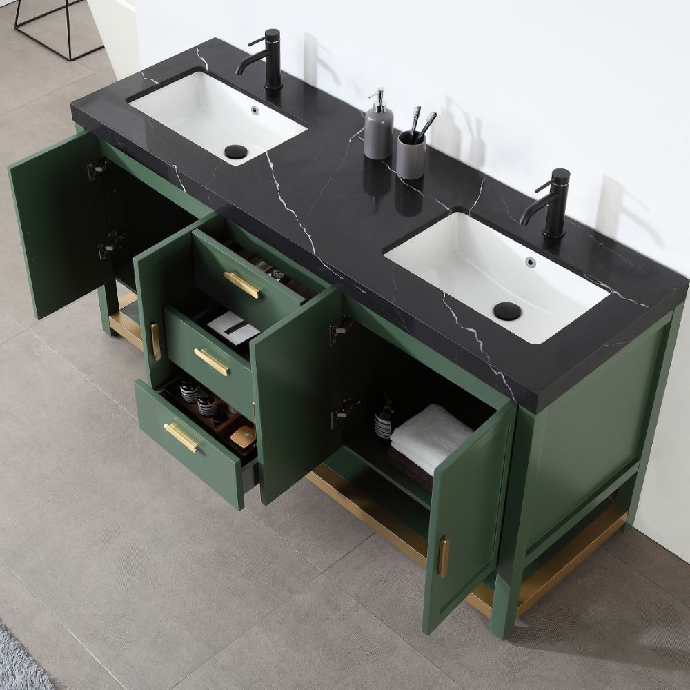 The Winchester 72 inch Freestanding Double Bathroom Vanity in Forest Green features a sleek black marble countertop with dual white sinks and black faucets. Gold handles accent its cabinets, which open to reveal neatly arranged towels and essentials, complemented by two open drawers.