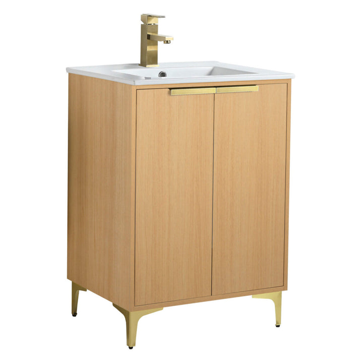 The Wilmington 24 Inch Bathroom Vanity With Sink showcases a modern wooden design with a sleek brass faucet. It has a cabinet with two doors and brass handles, and it stands elegantly on four sturdy brass legs.