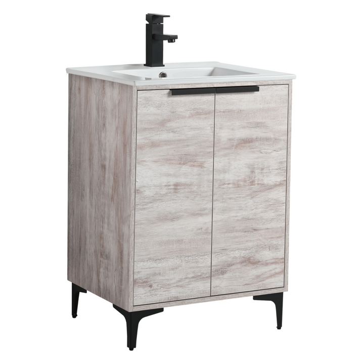 The Wilmington 24 Inch Bathroom Vanity With Sink boasts a light wood finish, black faucet, and modern allure. It includes a rectangular white sink over two rustic-textured doors with sleek black metal legs.